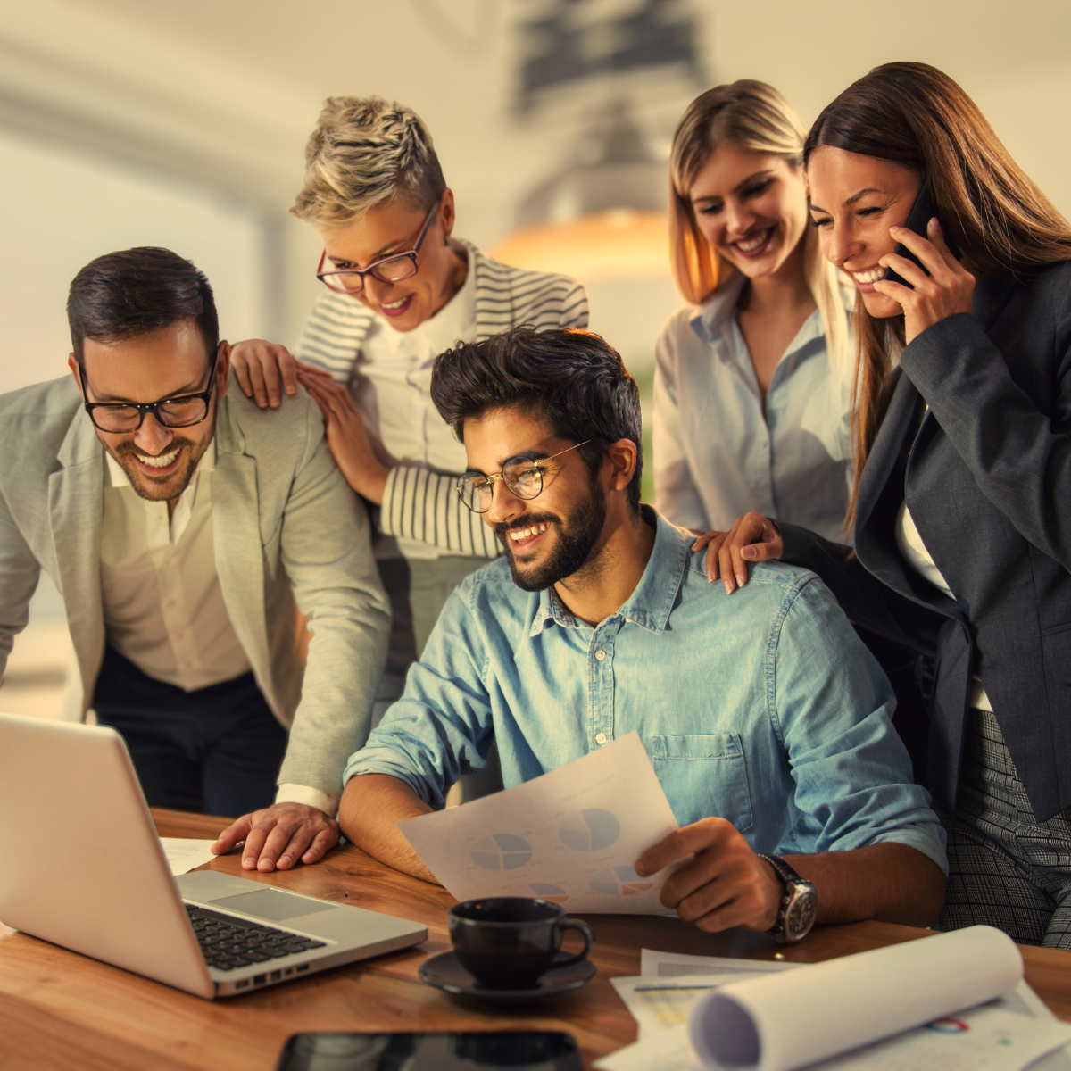 Smiling team reviewing data together